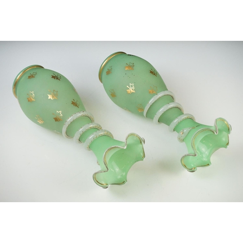 55 - Pair of Trumpet Shape Green Glass Vases, the necks with applied pale green glass entwined snakes, 27... 