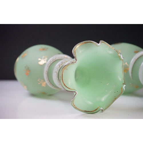 55 - Pair of Trumpet Shape Green Glass Vases, the necks with applied pale green glass entwined snakes, 27... 