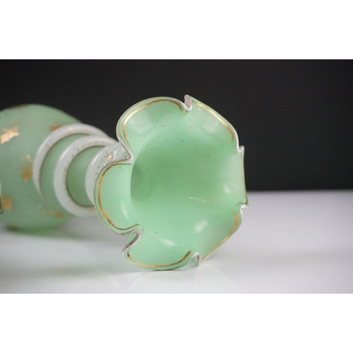 55 - Pair of Trumpet Shape Green Glass Vases, the necks with applied pale green glass entwined snakes, 27... 