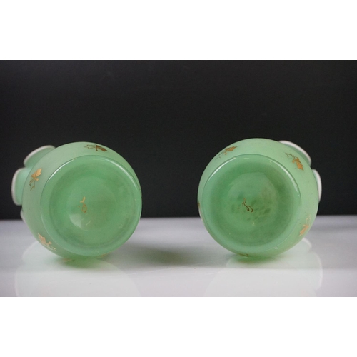 55 - Pair of Trumpet Shape Green Glass Vases, the necks with applied pale green glass entwined snakes, 27... 