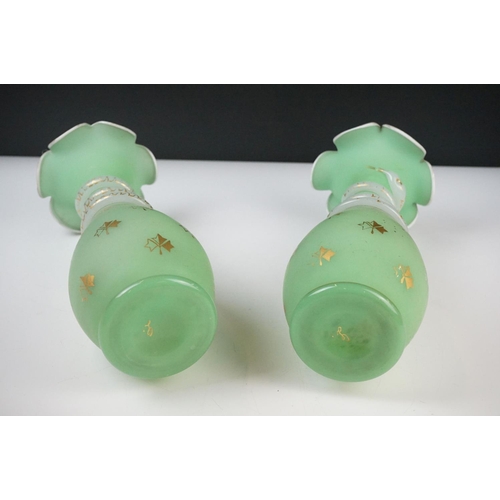 55 - Pair of Trumpet Shape Green Glass Vases, the necks with applied pale green glass entwined snakes, 27... 