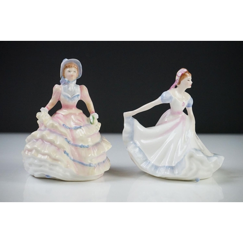 57 - Eleven Royal Doulton Figurines including Christmas Morn HN3212, Emma HN3208, Esmeralda HN2168, Fragr... 