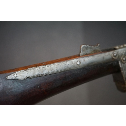 160 - An Early 19th Century Indian Matchlock Rifle With White Metal Furniture.