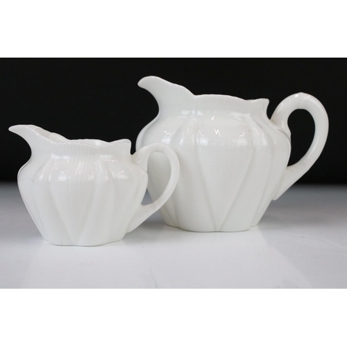 131 - Shelley & Foley Dainty White Tea Wares of moulded lobed form, with leaf decoration (Shelley reg no. ... 