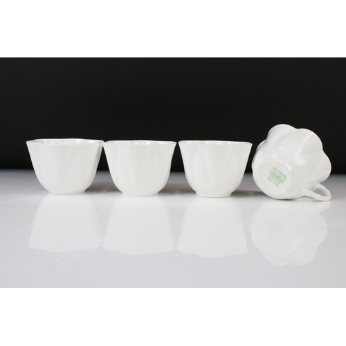 131 - Shelley & Foley Dainty White Tea Wares of moulded lobed form, with leaf decoration (Shelley reg no. ... 