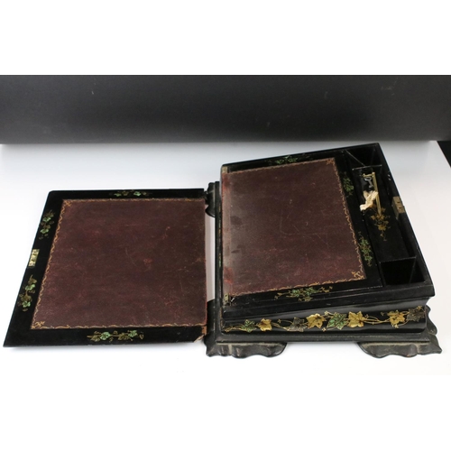 187 - Victorian black lacquered writing slope with abalone shell floral inlay to the hinged lid, gilt pain... 