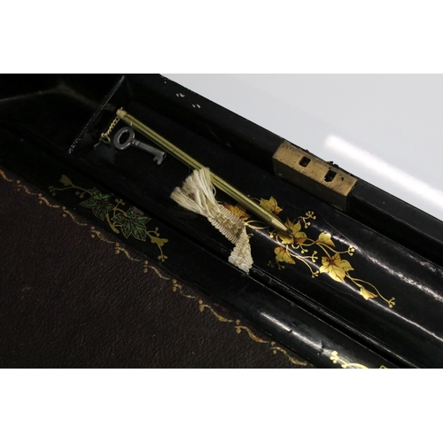 187 - Victorian black lacquered writing slope with abalone shell floral inlay to the hinged lid, gilt pain... 