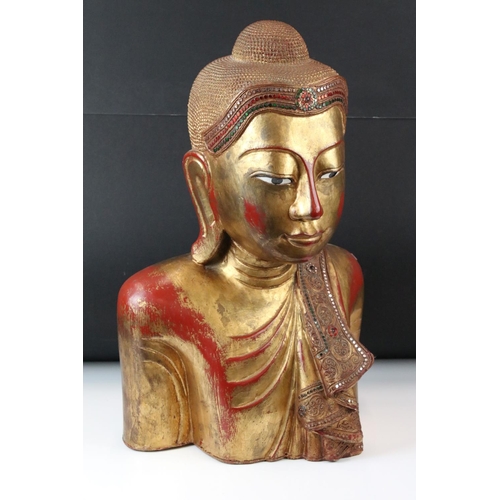 190 - Large South East Asian / Thai Wooden Buddha with a gilded and red lacquered finish, 56cm high