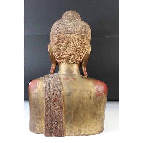 190 - Large South East Asian / Thai Wooden Buddha with a gilded and red lacquered finish, 56cm high