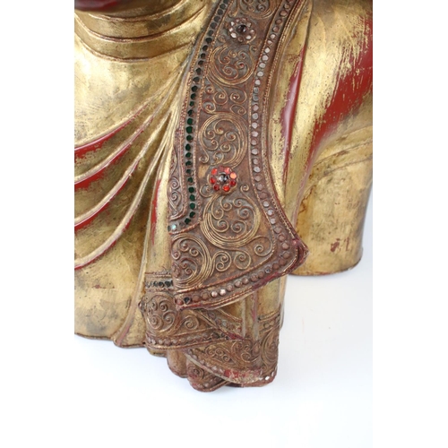 190 - Large South East Asian / Thai Wooden Buddha with a gilded and red lacquered finish, 56cm high