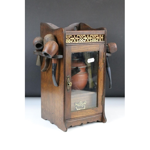 165 - Early 20th Century Oak Smokers Cabinet with glazed door, opening to reveal a terracotta jar & cover ... 