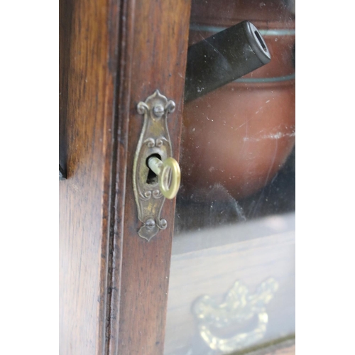 165 - Early 20th Century Oak Smokers Cabinet with glazed door, opening to reveal a terracotta jar & cover ... 