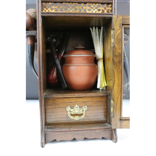 165 - Early 20th Century Oak Smokers Cabinet with glazed door, opening to reveal a terracotta jar & cover ... 