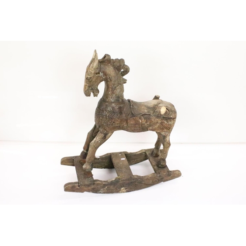 594 - Hardwood Rocking Horse, 71cm wide x 80cm high together with a Mid century Child's Pull-along Horse