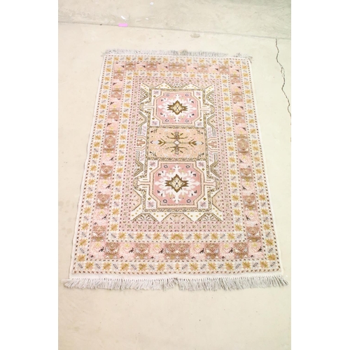 606 - Moroccan Pink and Cream Ground Wool Rug with stylised geometric pattern, 184cm x 126cm