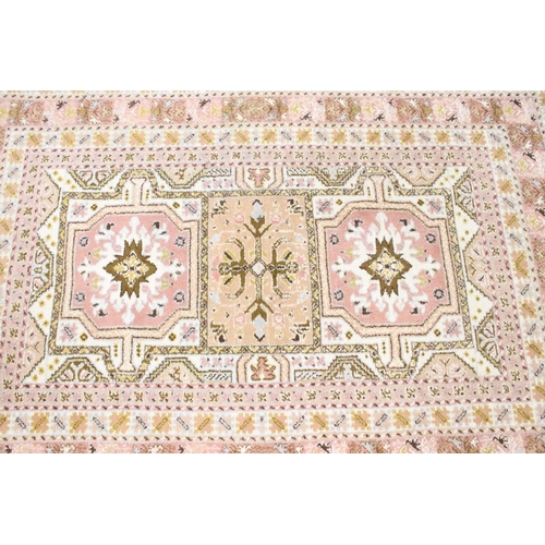 606 - Moroccan Pink and Cream Ground Wool Rug with stylised geometric pattern, 184cm x 126cm