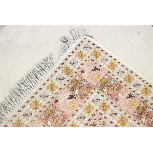 606 - Moroccan Pink and Cream Ground Wool Rug with stylised geometric pattern, 184cm x 126cm