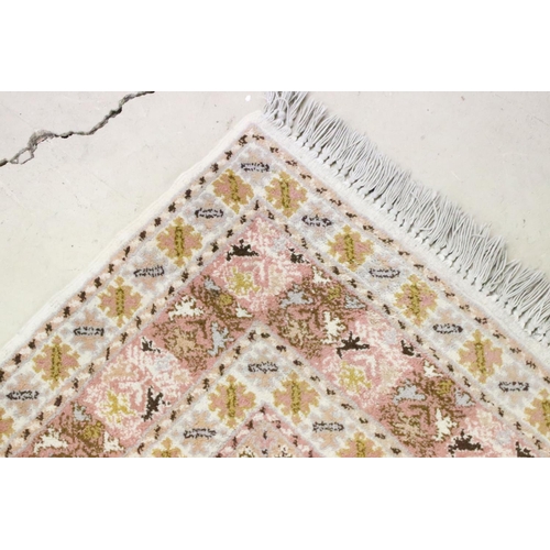 606 - Moroccan Pink and Cream Ground Wool Rug with stylised geometric pattern, 184cm x 126cm