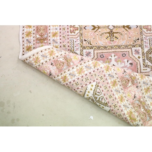 606 - Moroccan Pink and Cream Ground Wool Rug with stylised geometric pattern, 184cm x 126cm