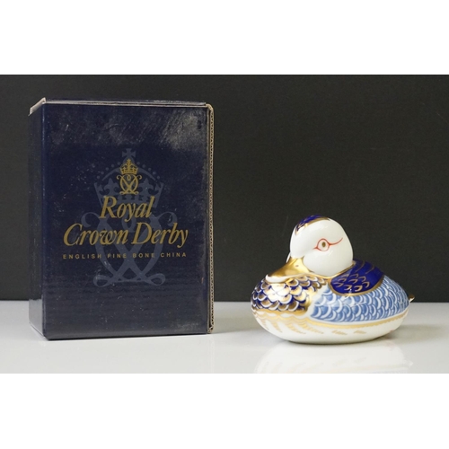 16 - Four Boxed Royal Crown Derby paperweights to include Collectors Guild Exclusive Molly (gold stopper)... 