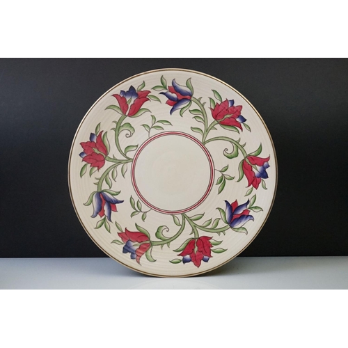 31 - Crown Ducal charger with floral decoration on a ribbed cream ground, 32cm diameter, together with a ... 