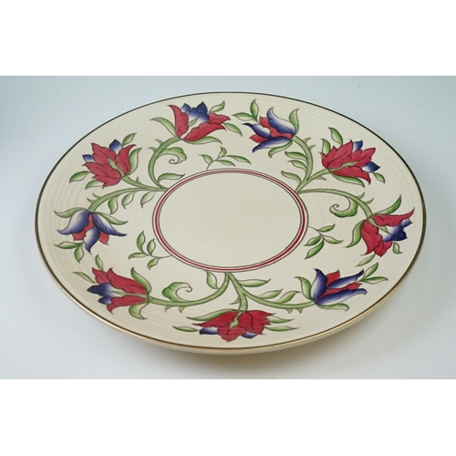 31 - Crown Ducal charger with floral decoration on a ribbed cream ground, 32cm diameter, together with a ... 