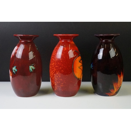 71 - Three Anita Harris Studio baluster vases to include an example with flame-like design on ox blood gr... 