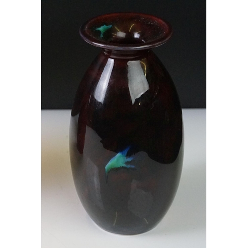 71 - Three Anita Harris Studio baluster vases to include an example with flame-like design on ox blood gr... 