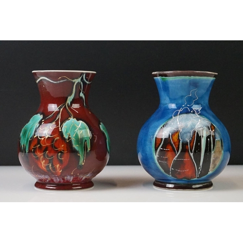 87 - Two Anita Harris Trojan shaped vases to include a trial vase with floral design on red ground, and a... 