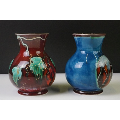 87 - Two Anita Harris Trojan shaped vases to include a trial vase with floral design on red ground, and a... 