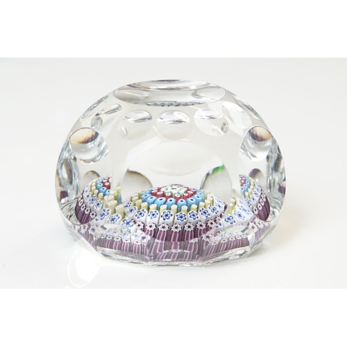 91 - Six 20th Century glass paperweights to include a faceted millefiori example, a Murano millefiori pap... 