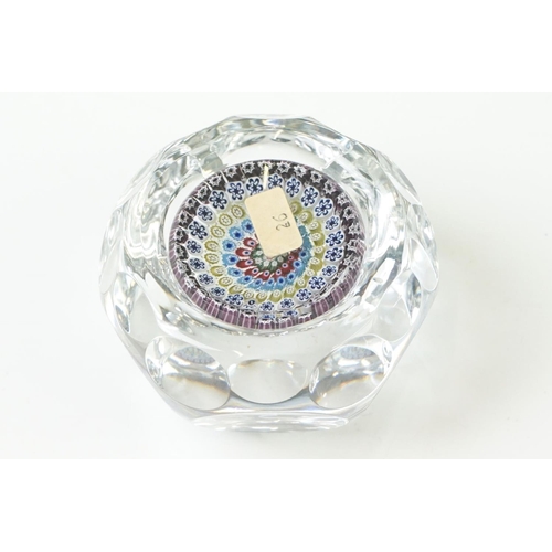 91 - Six 20th Century glass paperweights to include a faceted millefiori example, a Murano millefiori pap... 