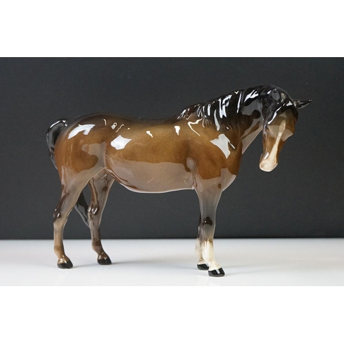 96 - Three Beswick porcelain figures to include a Palomino Prancing Arab Horse (17cm high), Brown Gloss h... 