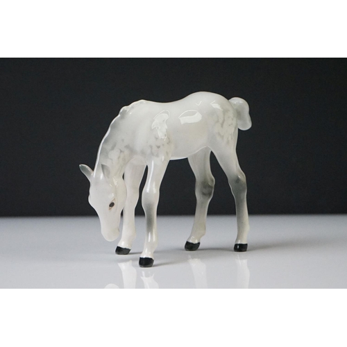 96 - Three Beswick porcelain figures to include a Palomino Prancing Arab Horse (17cm high), Brown Gloss h... 