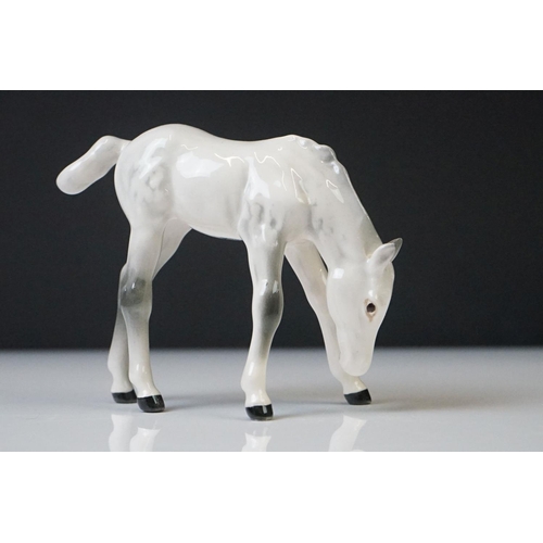 96 - Three Beswick porcelain figures to include a Palomino Prancing Arab Horse (17cm high), Brown Gloss h... 