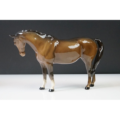 96 - Three Beswick porcelain figures to include a Palomino Prancing Arab Horse (17cm high), Brown Gloss h... 