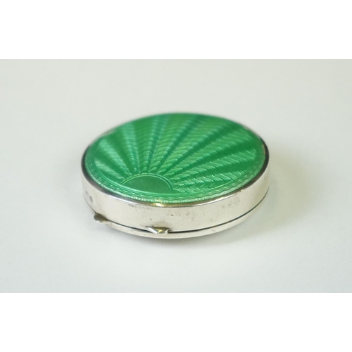 101 - A fully hallmarked sterling silver and enamel Art Deco powder compact with green guilloche decoratio... 