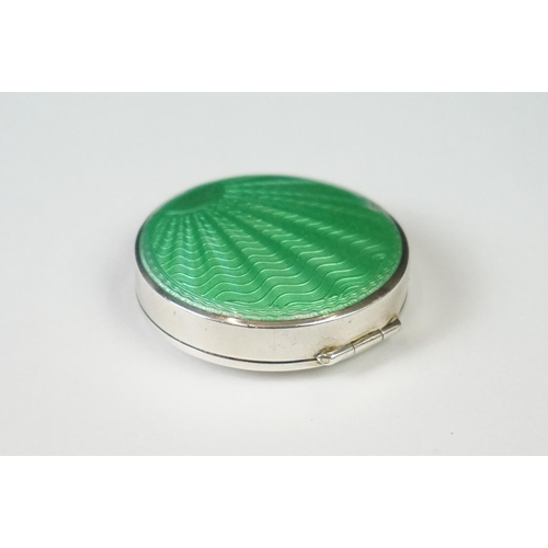 101 - A fully hallmarked sterling silver and enamel Art Deco powder compact with green guilloche decoratio... 