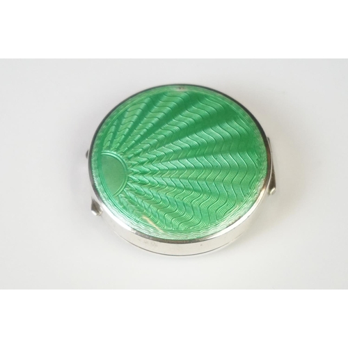 101 - A fully hallmarked sterling silver and enamel Art Deco powder compact with green guilloche decoratio... 