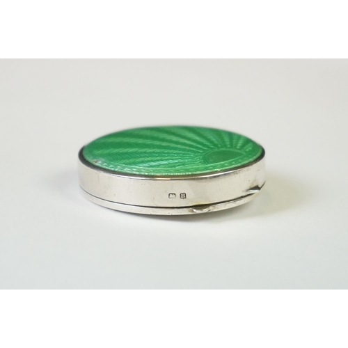 101 - A fully hallmarked sterling silver and enamel Art Deco powder compact with green guilloche decoratio... 