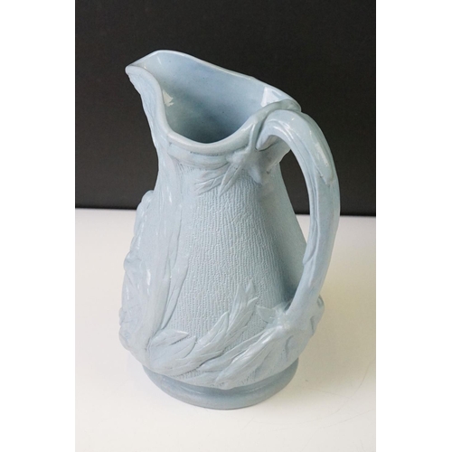 105 - Blue Stoneware Florence Nightingale jug, with relief moulded decoration depicting Florence Nightinga... 