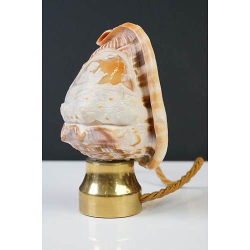 201 - A hand carved cameo shell converted into a table lamp.