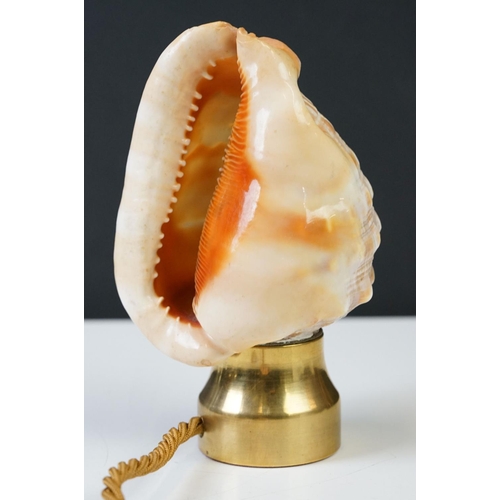 201 - A hand carved cameo shell converted into a table lamp.