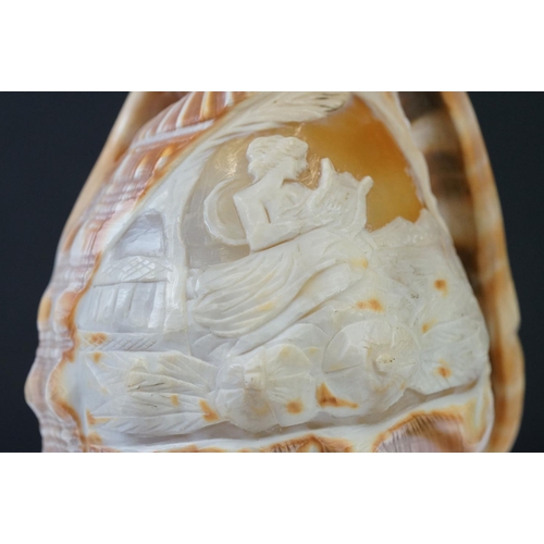 201 - A hand carved cameo shell converted into a table lamp.