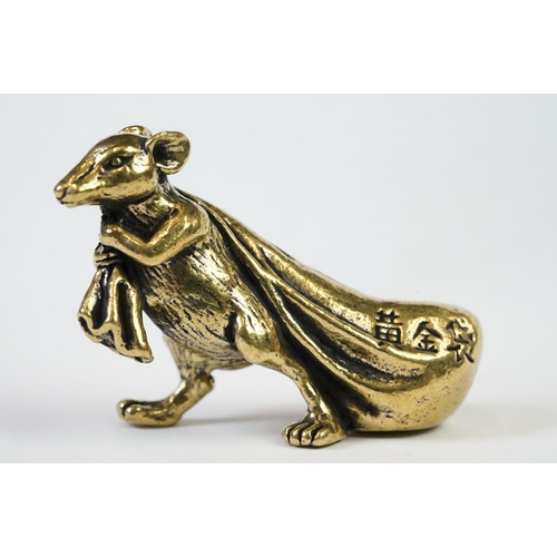 207 - An ornamental Solid brass lucky fortune rat with bag.