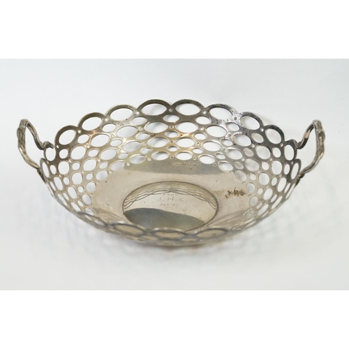 209 - A fully hallmarked sterling silver twin handled basket with pierced decoration, assay marked for Bir... 