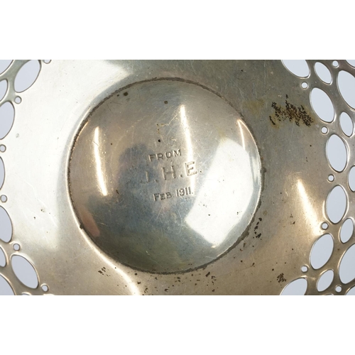 209 - A fully hallmarked sterling silver twin handled basket with pierced decoration, assay marked for Bir... 