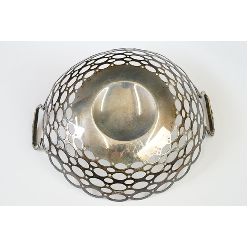 209 - A fully hallmarked sterling silver twin handled basket with pierced decoration, assay marked for Bir... 