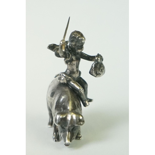 217 - A miniature fully hallmarked sterling silver figure of a cherub upon a pig, assay marked for Chester... 