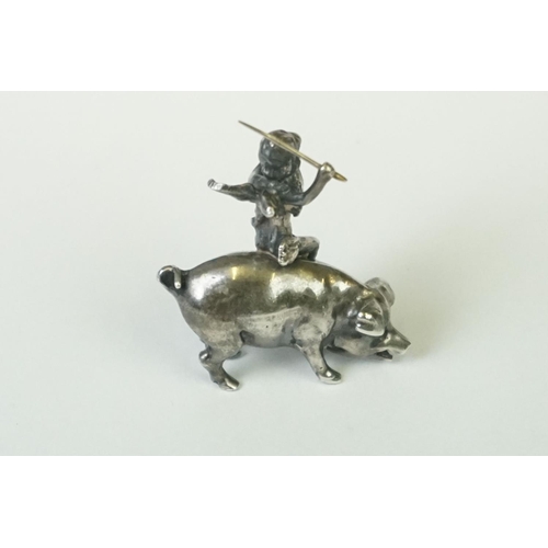 217 - A miniature fully hallmarked sterling silver figure of a cherub upon a pig, assay marked for Chester... 